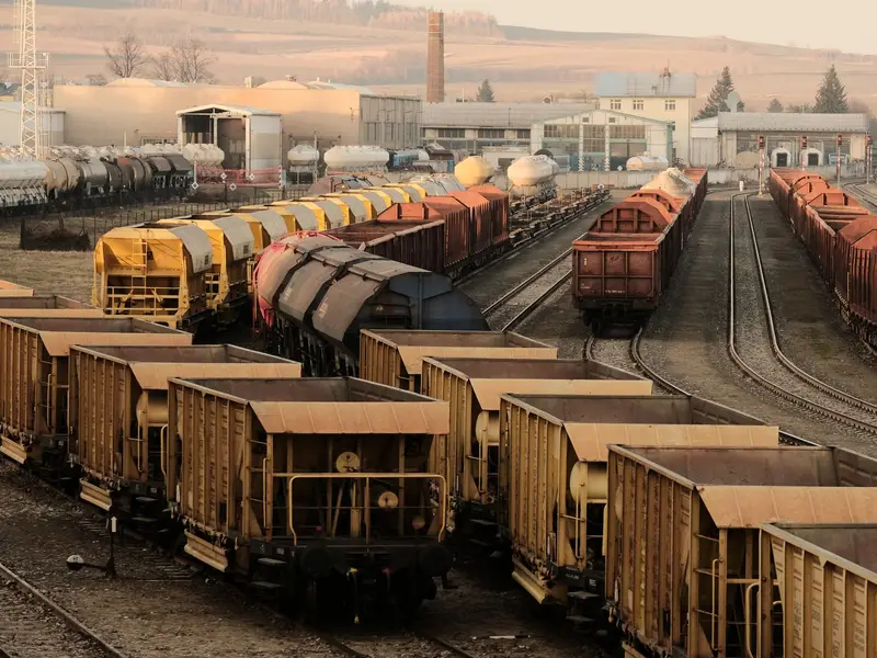 Freight rail yard with multiple tracks and rail cars